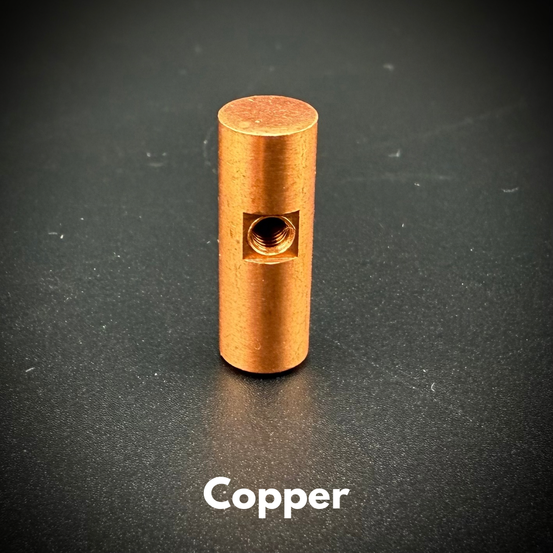 A close-up image of a copper replacement bolt for a bolt-action pen.