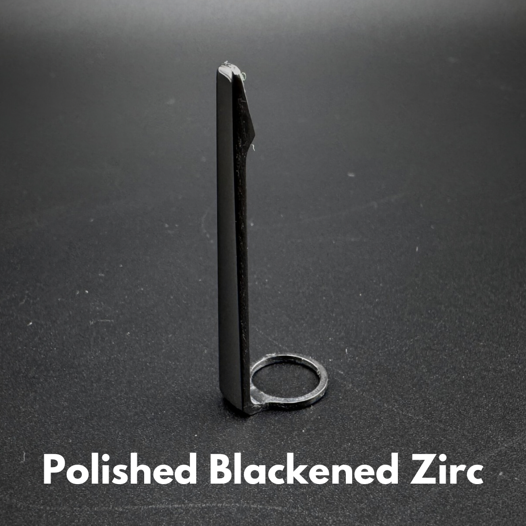 Photo of polished black zirconium machined pen clip